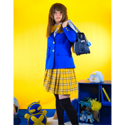 Female model (size C) in a blue Blazer and yellow pleated skirt.