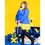 Female plus size model posing in a blue Blazer and yellow pleated skirt.